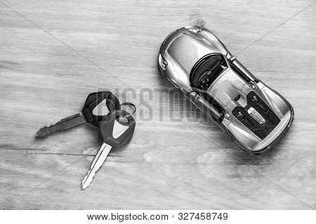 Car Loands And Credit Concepts. Car Symbol Along With Bunch Of Keys Against Vintage Wooden Backgroun
