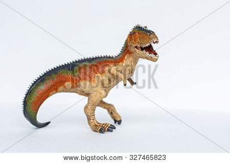 Dinosaur Toy Standing On White Background. Tyrannosaur Rex Toy