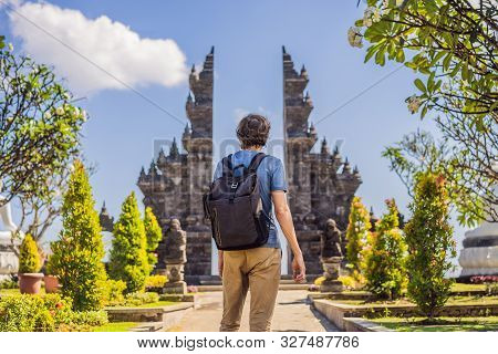 Young Man Tourist In Budhist Temple Brahma Vihara Arama Banjar Bali, Indonesia