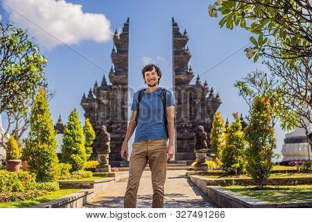 Young Man Tourist In Budhist Temple Brahma Vihara Arama Banjar Bali, Indonesia