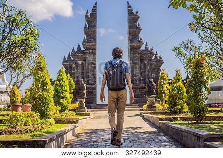 Young Man Tourist In Budhist Temple Brahma Vihara Arama Banjar Bali, Indonesia