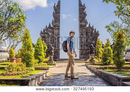 Young Man Tourist In Budhist Temple Brahma Vihara Arama Banjar Bali, Indonesia