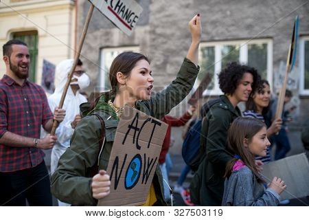 People With Placards And Posters On Global Strike For Climate Change, Shouting.