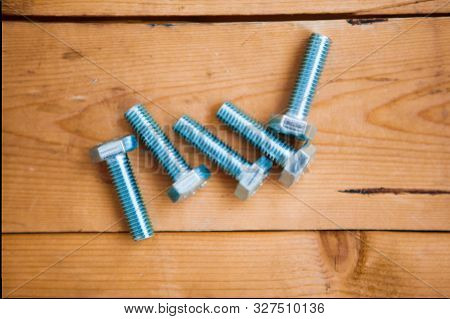 Set Of Metalware On The Wooden Background