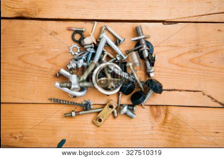Set Of Metalware On The Wooden Background