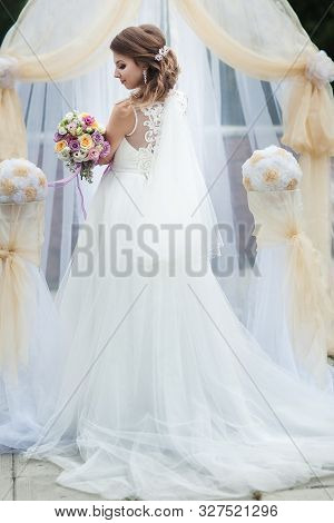 Portrait Of A Young Bride In A White Dress