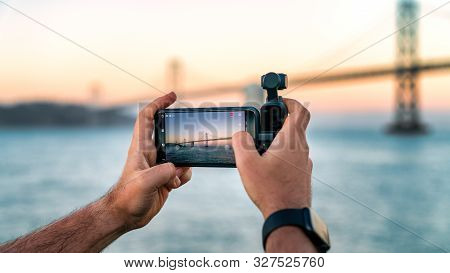 Usa, San Francisco - August 2019: A Photographer Is Using Dji Osmo Pocket To Take Footage Of A Bay B