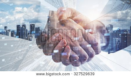 Sode View Of Businessmen Shaking Hands On Blurry Kuala Lumpur City Background. Team And Success Conc