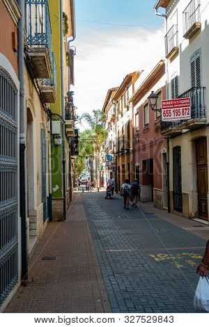 Denia, Valenciana, Spain - Sept 23 2019 : Streets Of Denia With Tourists Wandering Around.