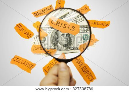 Male Hand Holding Magnifier Above 100 Dollars Stack Bombarded With Problems. Financial Research, Dol