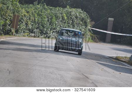 Pesaro Colle San Bartolo , Italy - Ott 12 - 2019 : Morris Mini Cooper S On An Old Racing Car In Rall