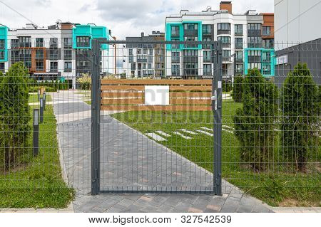 Closed Territory Of House Building, Gate With Empty Tablet