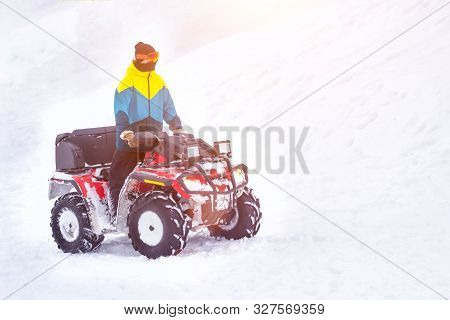 A Man Rides A Lot Of Snow On An Atv In Winter, Background, Quadracycle, Copy Space