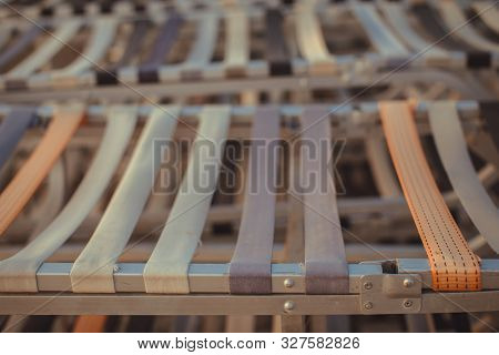 Old Aluminum Beach Loungers After The End Of The Summer Season. Aluminum Structures With Fabric Tape