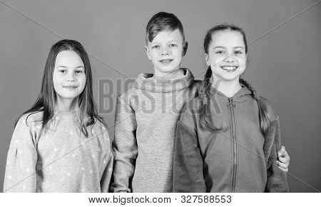 Girl And Boy True Friendship. Children Smiling Faces On Violet Background. Friends Hug. Childrens Da
