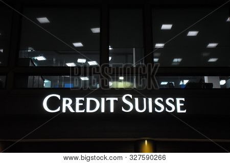 Milan, Italy, 08.04.2019: Logo Of The Swiss Credit Suisse Banking Group, During The Night In The Hea