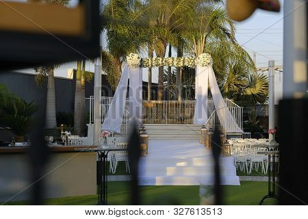 Beautiful Photo Of The Jewish Hupa , Wedding Putdoor .two Glasses And Bottle Of Wine And Glass It Is