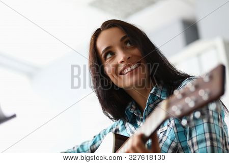 Close-up Of Beautiful Woman Learning New Musical Composition. Wonderful Female Wearing Checkered Fas