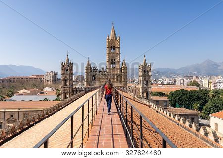 Woman Tourist Visitor Walking On The Rooftop Catwalk Of The Palermo Cathedral Or Cattedrale Di Paler