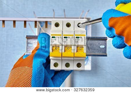Installing A Circuit Breaker At Home. Electrical Box, Consumer Unit, Fuse Board Installs. Using Comb