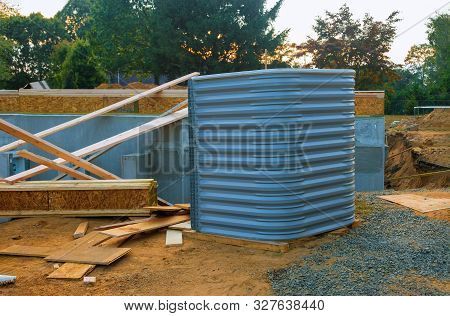 Building Window Well Basement For New Wood Materials Under Construction Home.
