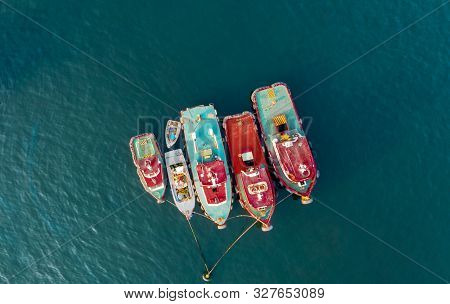 Aerial Top View Photo Of Red Traditional Wooden Fishing Boat In The Harbor