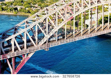 New York - July 02 2016: Aerial View Of And Amtrak Train Crossing The Hell Gate Bridge In New York C