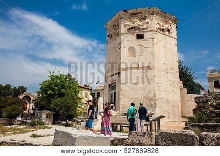 Athens, Greece - April, 2018: Tourists Visiting The Tower Of The Winds Or The Horologion Of Andronik