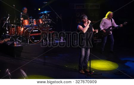HUNTINGTON - OCT 10: (L-R) Matt Frenette, Mike Reno and Ken Sinnaveve of Loverboy perform in concert at the Paramount on October 10, 2019 in Huntington, New York.