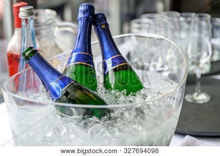 Rose Flowers Ice Cooled Sparkling Wine And Champagne Bottle In Bucket On A Party Unlabeled Textspace