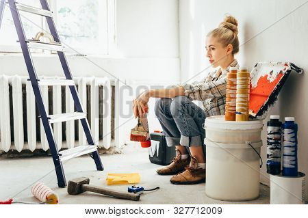 Pretty Young Woman Makes Diy Repairs In The House With Her Own Hands. Concept Nontraditional Gender 