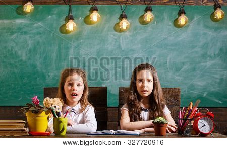 Smiling Little Girl, Writting Text On Blackboar. School Lessons. Back To School And Childhood Concep