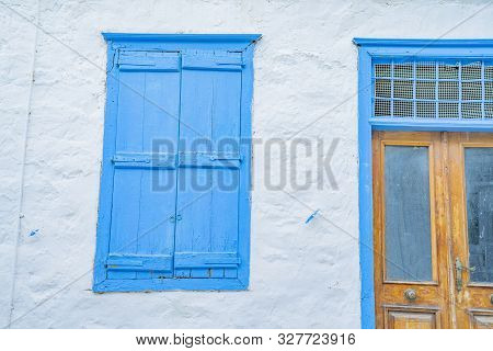 Hydra, Greek Island  Building Whitewashed With Blue Door And Shutter