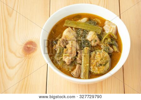 Pork Curry With Thai Morning Glory With Red Curry In White Bowl On Wooden Background. Thai Food.