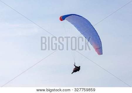 Togliatti, Russia - 10 March 2019. Paragliding On The Background Of Blue Sky. The Blue Paraglider Pe