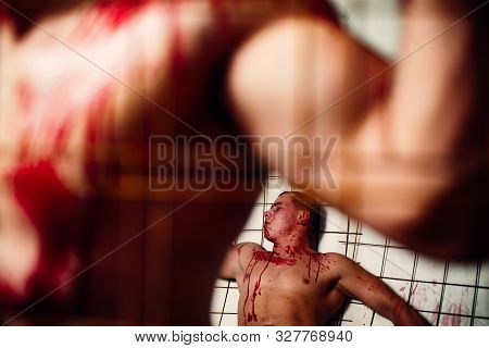 Prison For Monster. Psycho Mad Man. Murderer Mythical Creature. Muscular Man Soiled With Red Blood. 