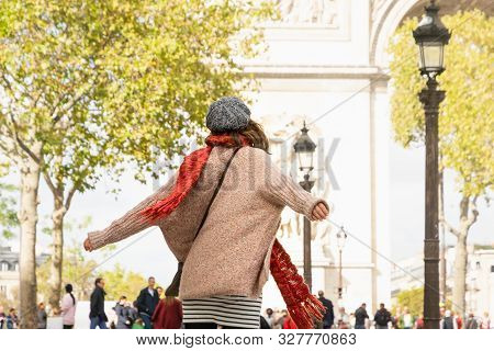 Beautiful Woman With Hands Outstretched In Paris. Vacations Lifestyle. Woman Expressing Happiness .v