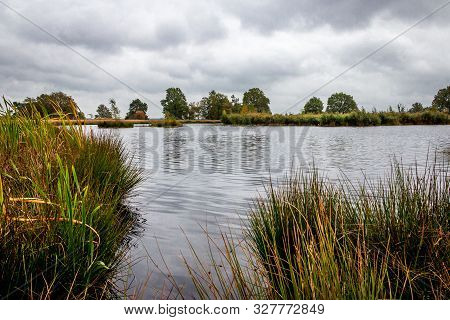 Beautiful lake in the middle of moorland at National park Dwingelderveld, province Drenthe the Nethe