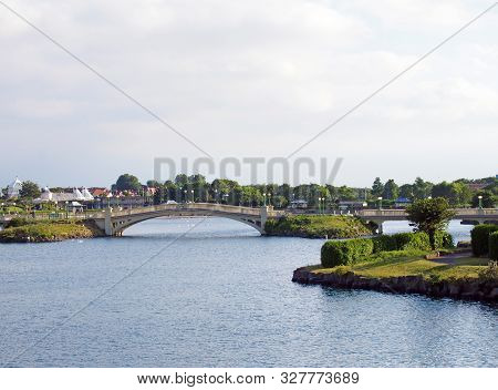 Southport, Merseyside, United Kingdom - 28 June 2019: People On The Venetian Bridge Crossing The Lak