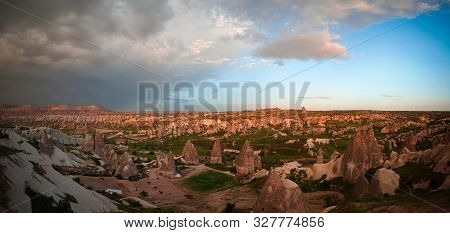 Sunset Panoramic View To Goreme City And Red, Rose And Meskendir Valleys Cappadocia, Turkey