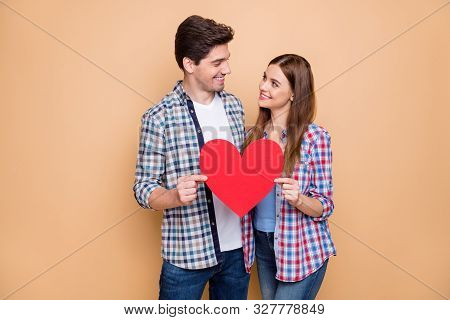 You My World. Portrait Of Romantic Married Spouses Hold Red Big Papercard Heart Look Enjoy 14-februa