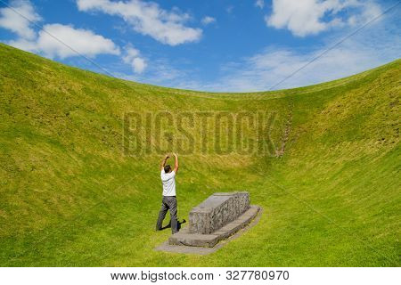 Man with open arms at the the Irish Sky Garden Crater, Skibbereen, West Cork. Ireland