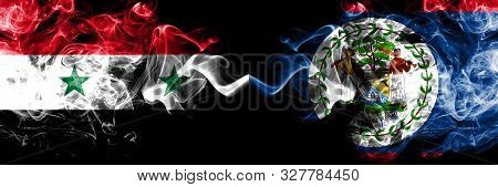 Syria Vs Belize, Belizean Smoke Flags Placed Side By Side. Thick Colored Silky Smoke Flags Of Syrian
