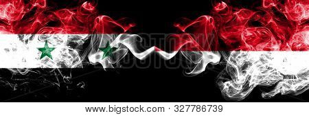 Syria Vs Monaco, Monacan Smoke Flags Placed Side By Side. Thick Colored Silky Smoke Flags Of Syrian 