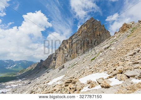 Swiss Barglen Mountain Near Melchsee-frutt In Cloudy Blue Sky