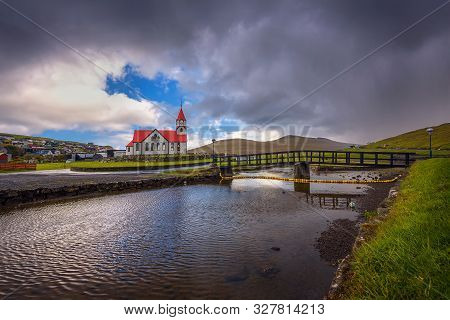 Sandavagur Church With Red Roof Also Called Sandavags Kirkja And The River Stora Located In The Pict