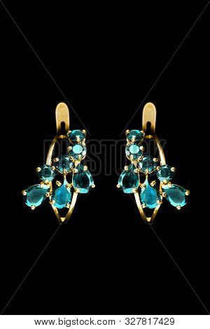 Eletant Topaz Gold Earrings On Black Background