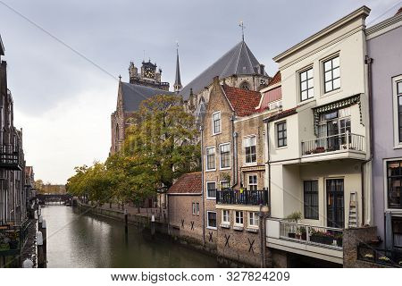 Pelserbrug Bridge And Historic Canal Houses Along The Voorstraathaven With The Church Grote Kerk In 