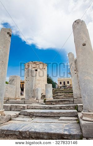 Athens, Greece - April, 2018: Tourists Visiting The Ancient Ruins At The Roman Agora Located To The