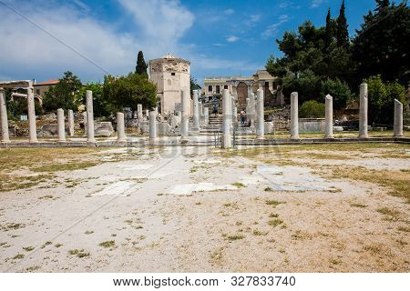 Athens, Greece - April, 2018: Tourists Visiting The Ancient Ruins At The Roman Agora Located To The